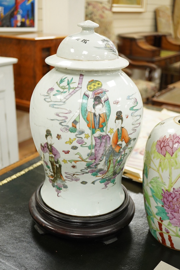 A Chinese famille rose vase and cover on stand, a smaller famille rose vase, vase and cover 50 cm high including stand., Condition - smaller vase in pieces and reglued.